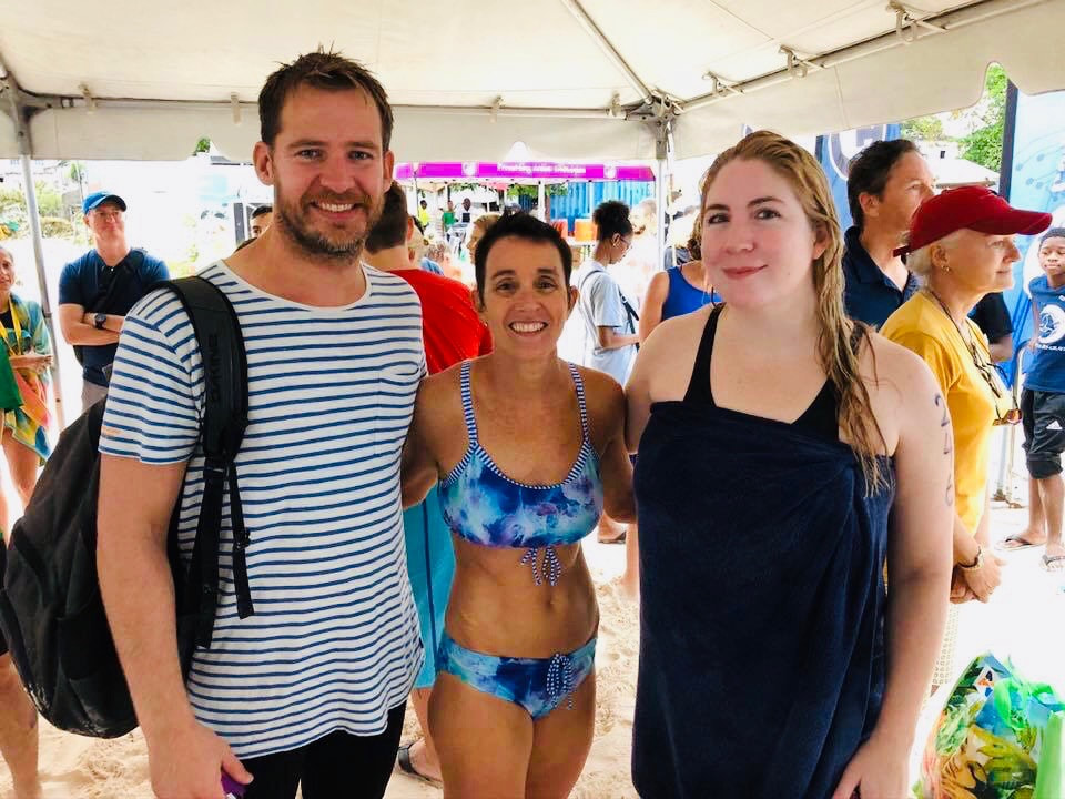 Cameron Bellamy and Jaimie Monahan pose with Beth Schiller at Barbados Open Water Festival