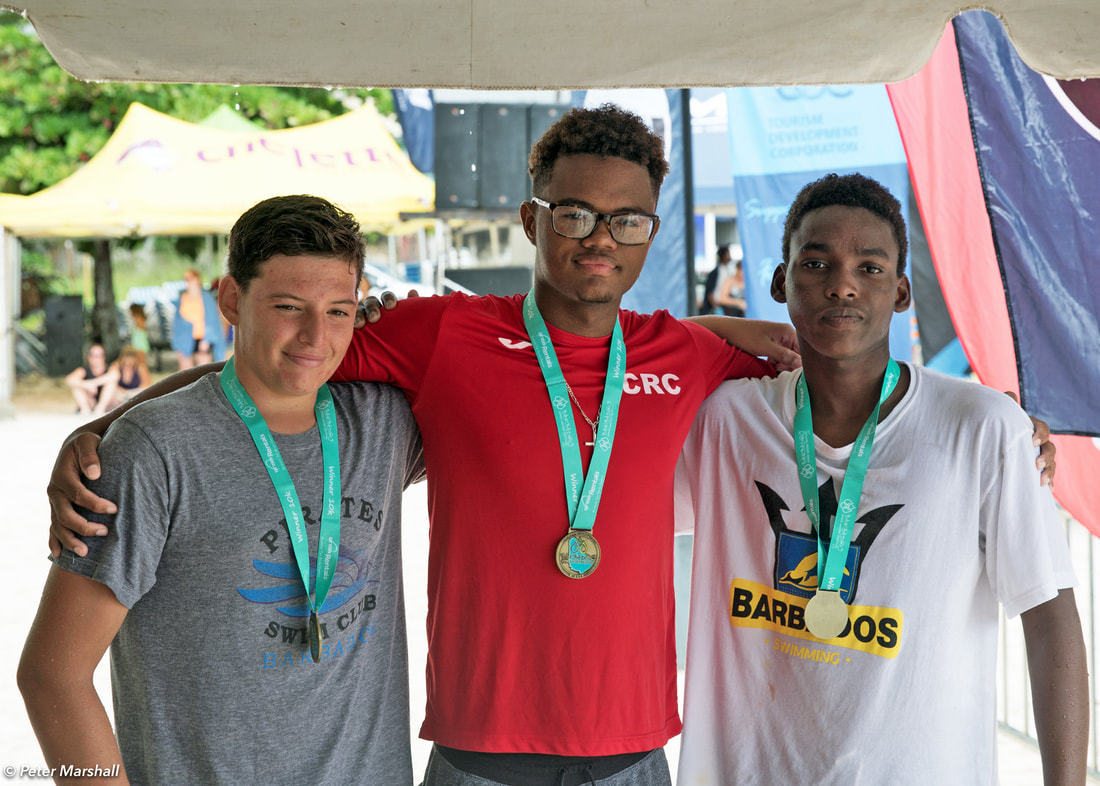 Neosi Dunwoody (centre) 10 K winner at Barbados Open Water Festival