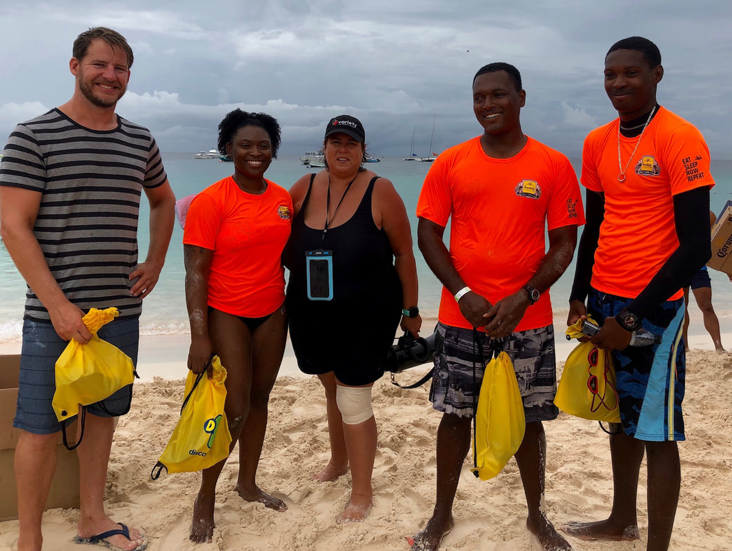 Cameron Bellamy & winners at charity swim in Barbados