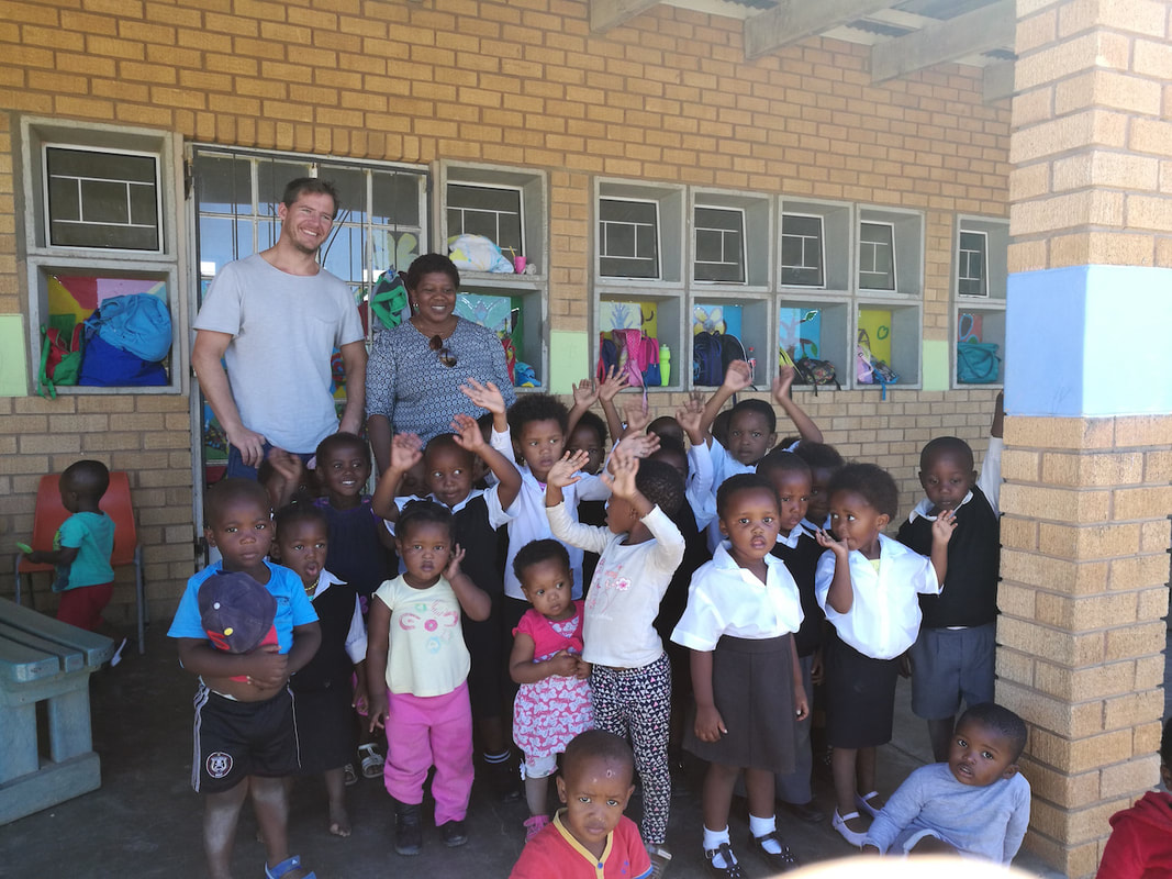 Cameron Bellamy visit a school supported by Ubunye Challenge